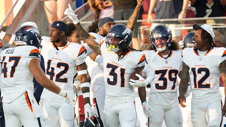 Aug 9, 2025; Santa Clara, California, USA;  Denver Broncos inside linebacker Karene Reid (47) and safety Drew Sanders (42) and cornerback Kris Abrams–Draine (31) and cornerback Joshua Pickett (39) and cornerback Jahdae Barron (12) celebrate an interception, that was later nullified, in the third quarter against the San Francisco 49ers at Levi's Stadium. Mandatory Credit: David Gonzales-Imagn Images