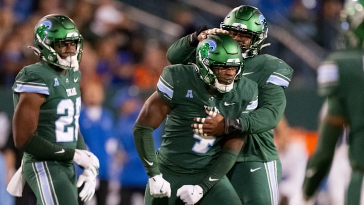 Nov 28, 2024; New Orleans, Louisiana, USA; Tulane Green Wave linebacker Chris Rodgers (4) celebrates a tackle of Memphis Tigers quarterback Seth Henigan (9) during the second quarter at Yulman Stadium.