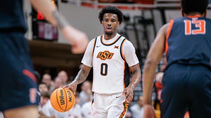 Dec 21, 2025; Stillwater, Oklahoma, USA; Oklahoma State Cowboys guard Jaylen Curry (0) brings the ball up court during the first half against the Cal State Fullerton Titans at Gallagher-Iba Arena. Mandatory Credit: William Purnell-Imagn Images Dec 21, 2025; Stillwater, Oklahoma, USA; Oklahoma State Cowboys guard Jaylen Curry (0) brings the ball up court during the first half against the Cal State Fullerton Titans at Gallagher-Iba Arena. Mandatory Credit: William Purnell-Imagn Images