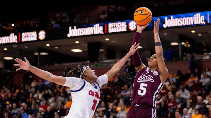 Mar 6, 2025; Greenville, SC, USA; Mississippi State Bulldogs guard Chandler Prater (5) shoots against Ole Miss Rebels guard Kennedy Todd-Williams (3) during the first half at Bon Secours Wellness Arena. Mandatory Credit: Scott Kinser-Imagn Images