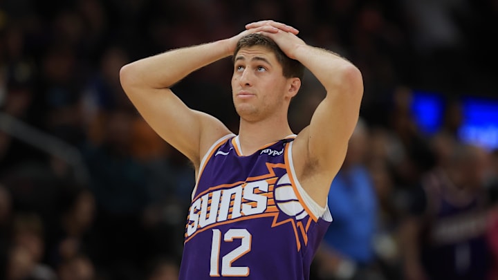 Apr 8, 2025; Phoenix, Arizona, USA; Phoenix Suns guard Collin Gillespie (12) reacts against the Golden State Warriors during the first half at Footprint Center. Mandatory Credit: Mark J. Rebilas-Imagn Images