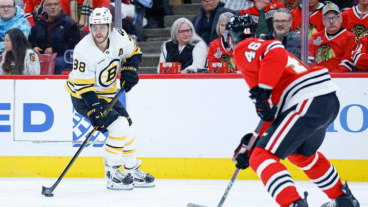 Jan 17, 2026; Chicago, Illinois, USA; Boston Bruins right wing David Pastrnak (88) looks to pass the puck against Chicago Blackhawks defenseman Matt Grzelcyk (48) during the first period at United Center. Mandatory Credit: Kamil Krzaczynski-Imagn Images Jan 17, 2026; Chicago, Illinois, USA; Boston Bruins right wing David Pastrnak (88) looks to pass the puck against Chicago Blackhawks defenseman Matt Grzelcyk (48) during the first period at United Center. Mandatory Credit: Kamil Krzaczynski-Imagn Images