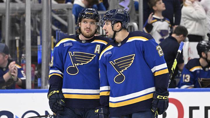 Apr 1, 2024; St. Louis, Missouri, USA; St. Louis Blues center Jordan Kyrou (25) talks with center Robert Thomas (18)  during the second period of a hockey game against the Edmonton Oilers at Enterprise Center. Mandatory Credit: Jeff Le-Imagn Images
