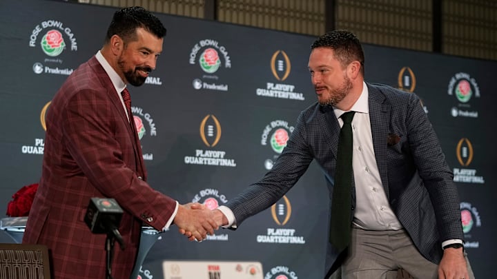 Ohio State Buckeyes head coach Ryan Day shakes hands with Oregon Ducks head coach Dan Lanning during a Rose Bowl press conference in Los Angeles on Dec. 31, 2024.