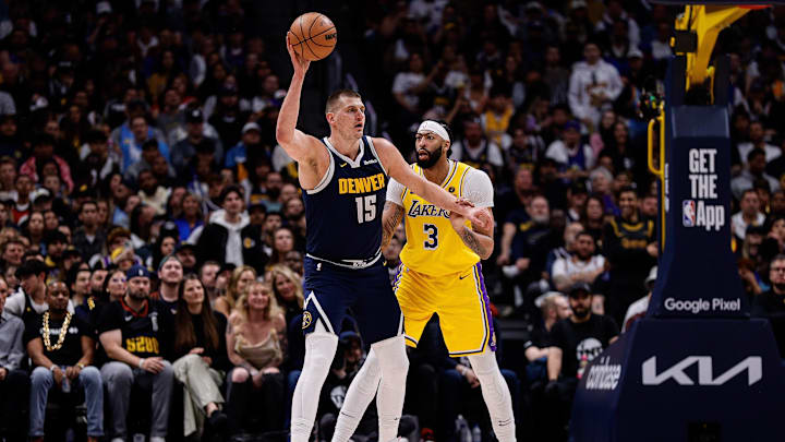 Apr 29, 2024; Denver, Colorado, USA; Denver Nuggets center Nikola Jokic (15) controls the ball as Los Angeles Lakers forward Anthony Davis (3) guards in the first quarter during game five of the first round for the 2024 NBA playoffs at Ball Arena. Mandatory Credit: Isaiah J. Downing-USA TODAY Sports Apr 29, 2024; Denver, Colorado, USA; Denver Nuggets center Nikola Jokic (15) controls the ball as Los Angeles Lakers forward Anthony Davis (3) guards in the first quarter during game five of the first round for the 2024 NBA playoffs at Ball Arena. Mandatory Credit: Isaiah J. Downing-USA TODAY Sports