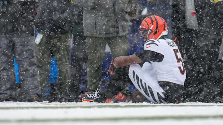 Cincinnati Bengals wide receiver Tee Higgins (5) waits for trainers after hitting his head on the ground on a catch in the second quarter of the NFL Week 14 game between the Buffalo Bills and the Cincinnati Bengals at Highmark Stadium in Orchard Park, N.Y., on Sunday, Dec. 7, 2025. Cincinnati Bengals wide receiver Tee Higgins (5) waits for trainers after hitting his head on the ground on a catch in the second quarter of the NFL Week 14 game between the Buffalo Bills and the Cincinnati Bengals at Highmark Stadium in Orchard Park, N.Y., on Sunday, Dec. 7, 2025.