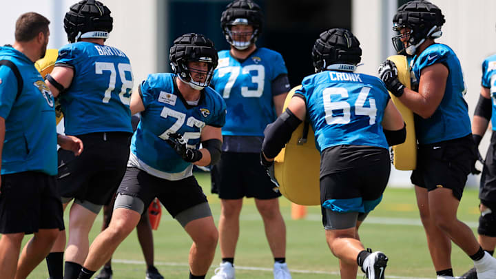 Jacksonville Jaguars offensive tackle Walker Little (72) looks to hit offensive tackle Coy Cronk