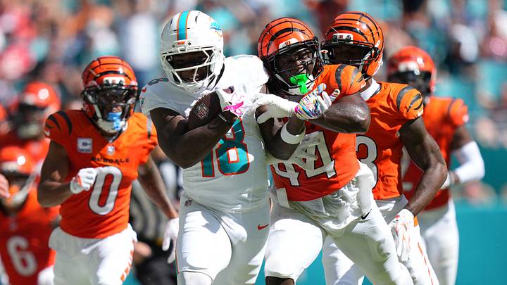Cincinnati Bengals linebacker Demetrius Knight Jr. (44) tackles Miami Dolphins wide receiver Chris Bell (18) during the third quarter at Hard Rock Stadium. Cincinnati Bengals linebacker Demetrius Knight Jr. (44) tackles Miami Dolphins wide receiver Chris Bell (18) during the third quarter at Hard Rock Stadium.
