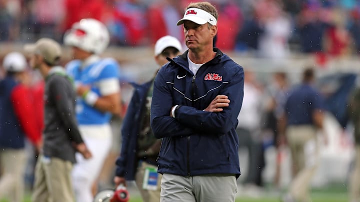 Nov 9, 2024; Oxford, Mississippi, USA; Mississippi Rebels head coach Lane Kiffin watches during warm ups prior to the game against the Georgia Bulldogs at Vaught-Hemingway Stadium. Mandatory Credit: Petre Thomas-Imagn Images Nov 9, 2024; Oxford, Mississippi, USA; Mississippi Rebels head coach Lane Kiffin watches during warm ups prior to the game against the Georgia Bulldogs at Vaught-Hemingway Stadium. Mandatory Credit: Petre Thomas-Imagn Images
