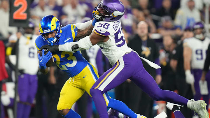 Los Angeles Rams running back Kyren Williams (23) is tackled by Minnesota Vikings linebacker Jonathan Greenard (58) during their playoff game at State Farm Stadium on Jan. 13, 2025, in Glendale. Los Angeles Rams running back Kyren Williams (23) is tackled by Minnesota Vikings linebacker Jonathan Greenard (58) during their playoff game at State Farm Stadium on Jan. 13, 2025, in Glendale.