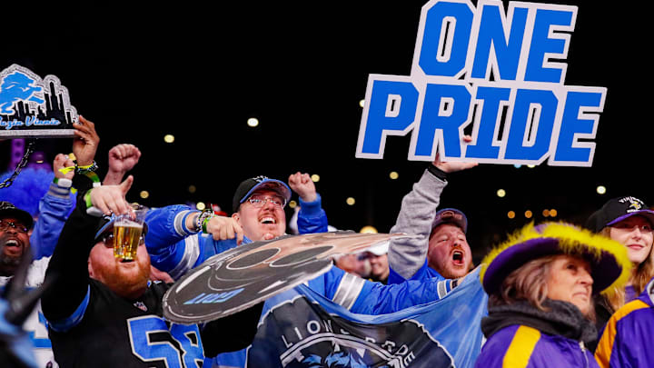 Detroit Lions fans cheer after the team selects Arkansas wide receiver Isaac TeSlaa with the 70th overall pick 