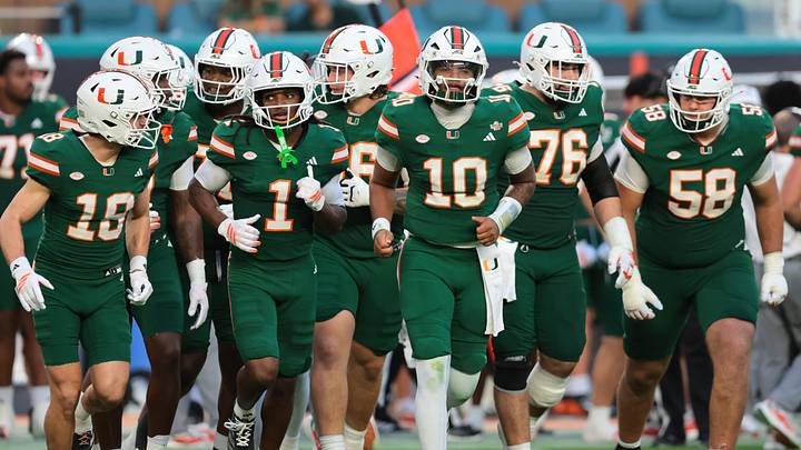 Sep 26, 2026; Miami Gardens, Florida, USA; Miami Hurricanes quarterback Darian Mensah (10) leads the offense onto the field against the Central Michigan Chippewas during the first quarter at Hard Rock Stadium. Mandatory Credit: Sam Navarro-Imagn Images