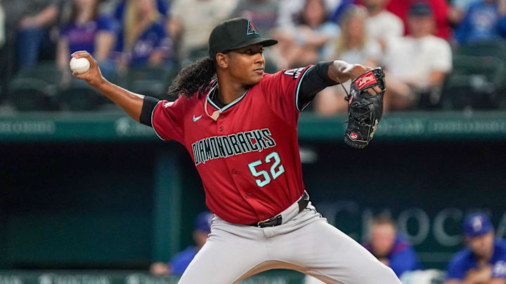 Aug 13, 2025; Arlington, Texas, USA; Arizona Diamondbacks relief pitcher Juan Burgos (52) throws to the plate during the seventh inning against the Arizona Diamondbacks at Globe Life Field. Mandatory Credit: Raymond Carlin III-Imagn Images