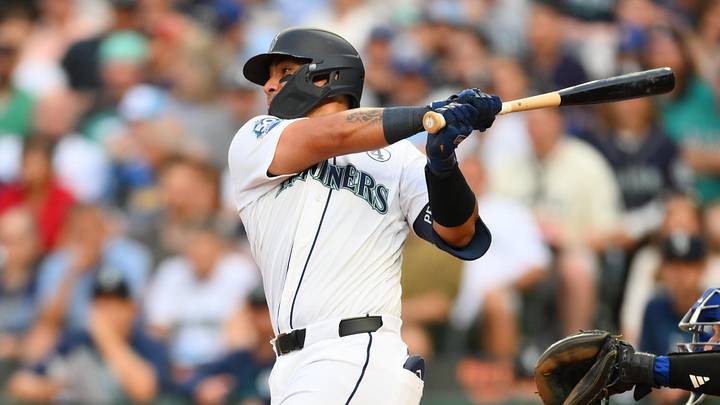 Jun 2, 2026; Seattle, Washington, USA; Seattle Mariners catcher Jhonny Pereda (5) hits a single against the New York Mets during the fourth inning at T-Mobile Park. Mandatory Credit: Steven Bisig-Imagn Images