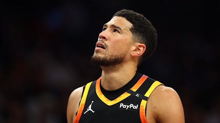 Apr 9, 2025; Phoenix, Arizona, USA; Phoenix Suns guard Devin Booker (1) reacts after a play against the Oklahoma City Thunder during the first half at Footprint Center. Mandatory Credit: Mark J. Rebilas-Imagn Images