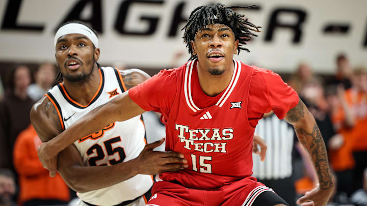Feb 15, 2025; Stillwater, Oklahoma, USA; Texas Tech Red Raiders forward JT Toppin (15) blocks out Oklahoma State Cowboys forward Robert Jennings II (25) during the first half at Gallagher-Iba Arena. Mandatory Credit: William Purnell-Imagn Images