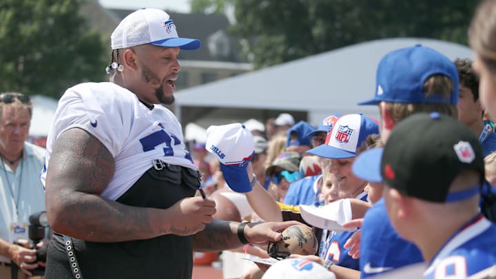 Bills offensive lineman Dion Dawkins signs autographs for fans during day five of Buffalo Bills training camp at St. John Fisher University Monday, July 28, 2025 in Pittsford, NY. Bills offensive lineman Dion Dawkins signs autographs for fans during day five of Buffalo Bills training camp at St. John Fisher University Monday, July 28, 2025 in Pittsford, NY.