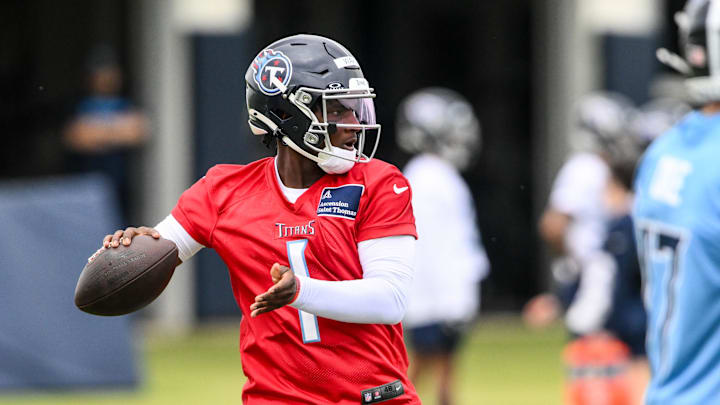 May 10, 2025; Nashville, TN, USA;  Tennessee Titans quarterback Cam Ward (1) throws a pass as he goes through drills during Rookie Mini Camp at Saint Thomas Sports Park. Mandatory Credit: Steve Roberts-Imagn Images