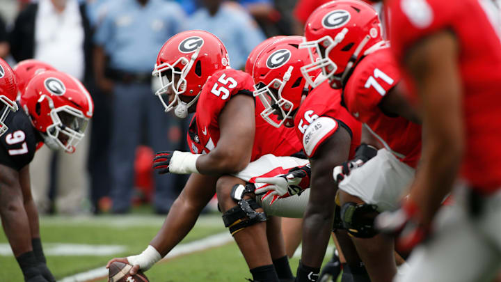 Georgia offensive lineman Jared Wilson (55) gets set to snap the ball during the G-Day spring football game in Athens, Ga., on Saturday, April 16, 2022. The black team won 26-23.

Syndication Online Athens