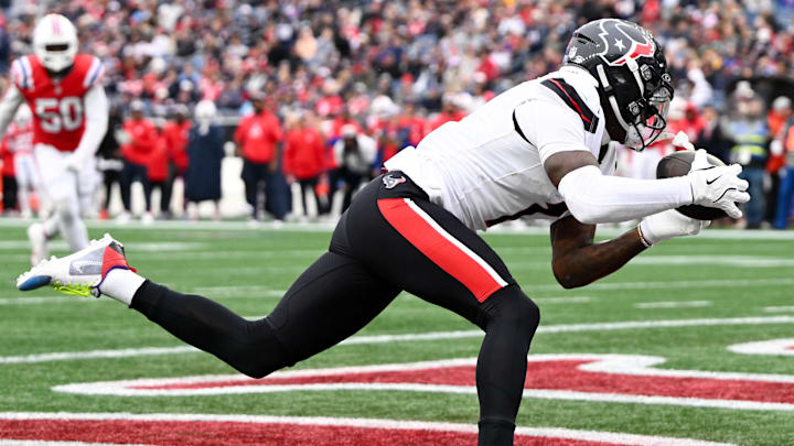 Oct 13, 2024; Foxborough, Massachusetts, USA; Houston Texans wide receiver Stefon Diggs (1) makes a catch for a touchdown against the New England Patriots during the second half at Gillette Stadium.