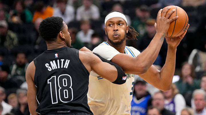 Apr 10, 2026; Milwaukee, Wisconsin, USA;  Milwaukee Bucks center Myles Turner (3) holds the ball away from Brooklyn Nets guard Malachi Smith (18) during the first quarter at Fiserv Forum. Mandatory Credit: Jeff Hanisch-Imagn Images