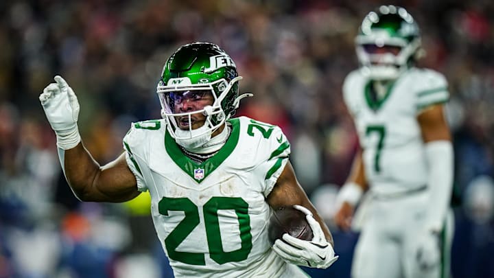 New York Jets running back Breece Hall (20) runs the ball against the New England Patriots in the third quarter at Gillette Stadium. New York Jets running back Breece Hall (20) runs the ball against the New England Patriots in the third quarter at Gillette Stadium.