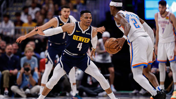 May 11, 2025; Denver, Colorado, USA; Oklahoma City Thunder guard Shai Gilgeous-Alexander (2) controls the ball as Denver Nuggets guard Russell Westbrook (4) guards in the third quarter during game four of the second round of the 2025 NBA Playoffs at Ball Arena. Mandatory Credit: Isaiah J. Downing-Imagn Images