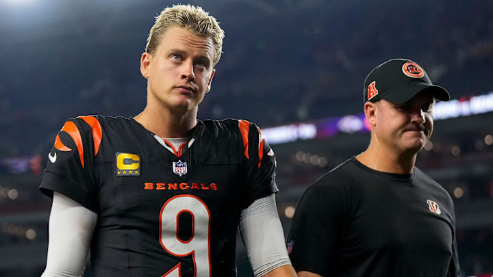 Cincinnati Bengals quarterback Joe Burrow (9) and head coach Zac Taylor head for the locker room after the fourth quarter of the NFL Week 3 game between the Cincinnati Bengals and the Washington Commanders at Paycor Stadium in downtown Cincinnati on Monday, Sept. 23, 2024. The Bengals remain winless after a 38-33 loss to Washington.