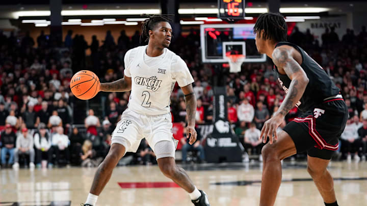 Cincinnati Bearcats guard Jizzle James (2) handles the ball in the first half of a NCAA men’s basketball game between the Cincinnati Bearcats and Texas Tech Red Raiders, Tuesday, Jan. 21, 2025, at Fifth Third Arena in Cincinnati