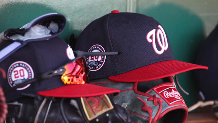 Apr 17, 2025; Pittsburgh, Pennsylvania, USA; Washington Nationals hats and gloves in the dugout against the Pittsburgh Pirates during the sixth inning at PNC Park. Mandatory Credit: Charles LeClaire-Imagn Images