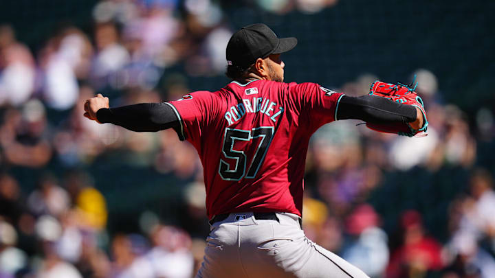 Sep 18, 2024; Denver, Colorado, USA; Arizona Diamondbacks starting pitcher Eduardo Rodriguez (57) delivers a pitch in the first inning against the Colorado Rockies at Coors Field. Mandatory Credit: Ron Chenoy-Imagn Images