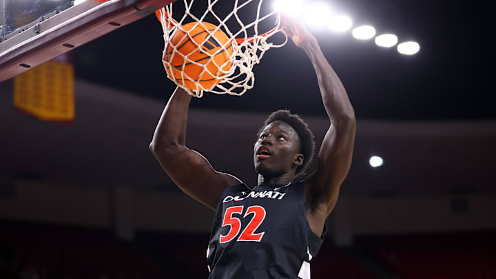Jan 24, 2026; Tempe, Arizona, USA; Cincinnati Bearcats center Moustapha Thiam (52) dunks the ball against the Arizona State Sun Devils in the first half at Desert Financial Arena. Mandatory Credit: Mark J. Rebilas-Imagn Images