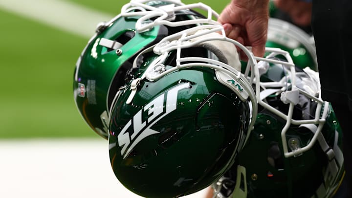 Oct 6, 2024; Tottenham, ENG; New York Jets helmets are held by staff before the match against Minnesota Vikings at Tottenham Hotspur Stadium. Mandatory Credit: Shaun Brooks-Imagn Images