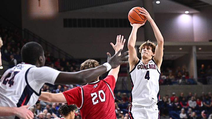 Nov 17, 2025; Spokane, Washington, USA; Gonzaga Bulldogs guard Davis Fogle (4) shoots the ball against Southern Utah Thunderbirds guard Dylan Jones (20) in the second half at McCarthey Athletic Center.
