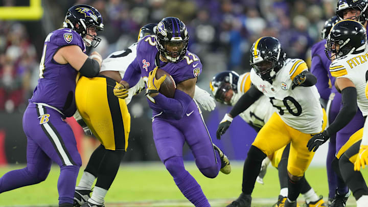 Dec 21, 2024; Baltimore, Maryland, USA; Baltimore Ravens running back Derrick Henry (22) runs for a gain against the Pittsburgh Steelers in the first quarter at M&T Bank Stadium. Mandatory Credit: Mitch Stringer-Imagn Images