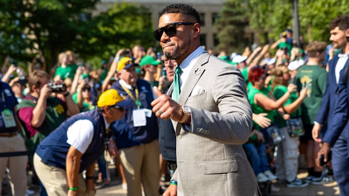 Oct 4, 2025; South Bend, Indiana, USA; Notre Dame Fighting Irish head coach Marcus Freeman gives a thumbs up to fans while walking to the stadium before a game against the Boise State Broncos at Notre Dame Stadium. Mandatory Credit: Michael Caterina-Imagn Images