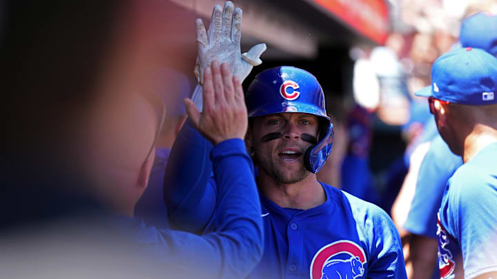 Jun 27, 2024; San Francisco, California, USA; Chicago Cubs second baseman Nico Hoerner (center) is congratulated by teammates after hitting a home run against the San Francisco Giants during the third inning at Oracle Park. Mandatory Credit: Darren Yamashita-Imagn Images