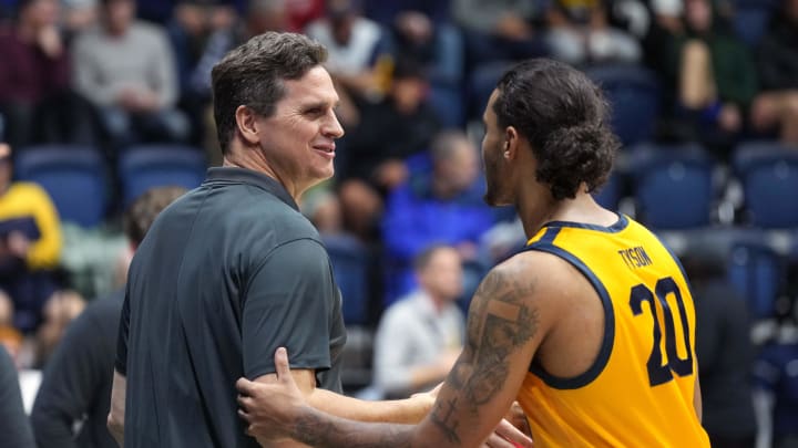 Dec 29, 2023; Berkeley, California, USA; California Golden Bears head coach Mark Madsen (left) greets guard Jaylon Tyson (20) before the game against the Arizona Wildcats at Haas Pavilion. Mandatory Credit: Darren Yamashita-USA TODAY Sports Dec 29, 2023; Berkeley, California, USA; California Golden Bears head coach Mark Madsen (left) greets guard Jaylon Tyson (20) before the game against the Arizona Wildcats at Haas Pavilion. Mandatory Credit: Darren Yamashita-USA TODAY Sports