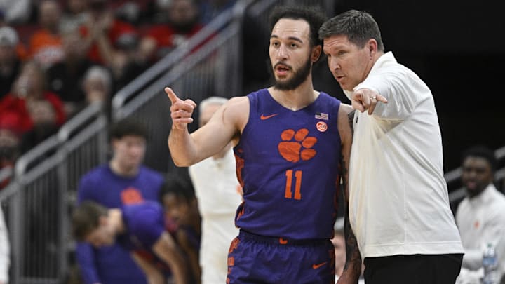 Jan 7, 2025; Louisville, Kentucky, USA; Clemson Tigers head coach Brad Brownell talks with guard Jaeden Zackery (11) during the first half against the Louisville Cardinals at KFC Yum! Center. Jan 7, 2025; Louisville, Kentucky, USA; Clemson Tigers head coach Brad Brownell talks with guard Jaeden Zackery (11) during the first half against the Louisville Cardinals at KFC Yum! Center.