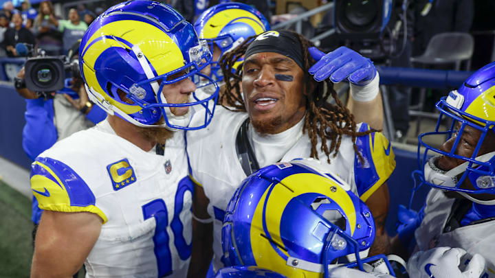 Nov 3, 2024; Seattle, Washington, USA; Los Angeles Rams wide receiver Demarcus Robinson (15, middle) celebrates with teammates, including wide receiver Cooper Kupp (10, left), after catching a game-winning touchdown pass against the Seattle Seahawks during overtime at Lumen Field. Mandatory Credit: Joe Nicholson-Imagn Images