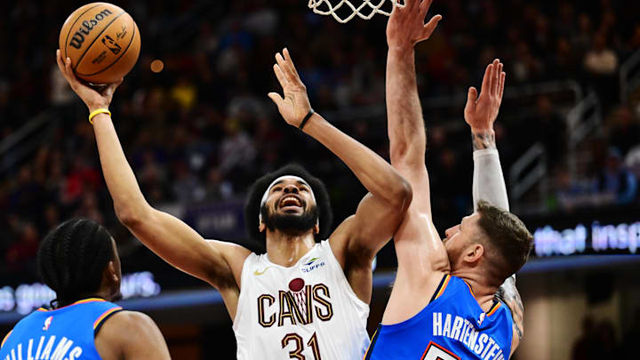 Jan 8, 2025; Cleveland, Ohio, USA; Cleveland Cavaliers center Jarrett Allen (31) drives to the basket against Oklahoma City Thunder center Isaiah Hartenstein (55) during the second half at Rocket Mortgage FieldHouse. Mandatory Credit: Ken Blaze-Imagn Images