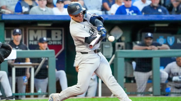 Jun 10, 2024; Kansas City, Missouri, USA; New York Yankees catcher Jose Trevino (39) hits a two-run single against the Kansas City Royals in the fourth inning at Kauffman Stadium.