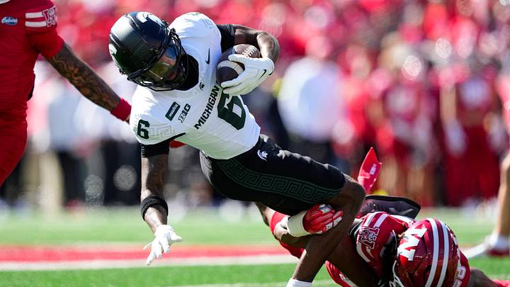 Oct 3, 2026; Madison, Wisconsin, USA; Michigan State Spartans wide receiver Fredrick Moore (6) is tackled after catching a pass during the second quarter against the Wisconsin Badgers at Camp Randall Stadium. Mandatory Credit: Jeff Hanisch-Imagn Images Oct 3, 2026; Madison, Wisconsin, USA; Michigan State Spartans wide receiver Fredrick Moore (6) is tackled after catching a pass during the second quarter against the Wisconsin Badgers at Camp Randall Stadium. Mandatory Credit: Jeff Hanisch-Imagn Images