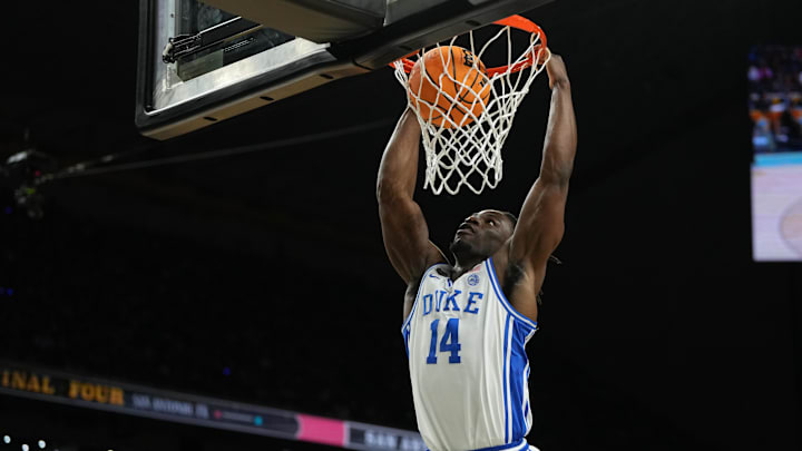 Apr 5, 2025; San Antonio, TX, USA; Duke Blue Devils guard Sion James (14) dunks during the second half in the semifinals of the men's Final Four of the 2025 NCAA Tournament at the Alamodome. Mandatory Credit: Bob Donnan-Imagn Images