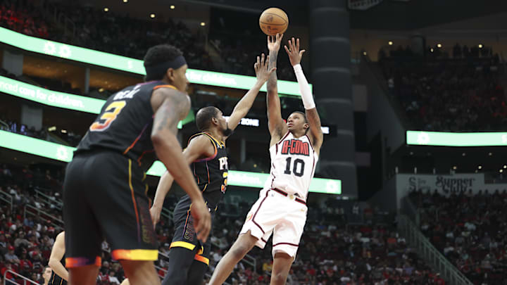 Mar 12, 2025; Houston, Texas, USA; Houston Rockets forward Jabari Smith Jr. (10) shoots the ball as Phoenix Suns forward Kevin Durant (35) defends during the fourth quarter at Toyota Center. Mandatory Credit: Troy Taormina-Imagn Images