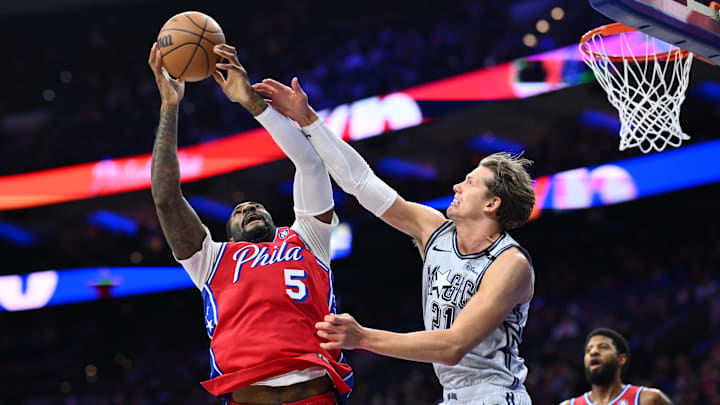 Dec 6, 2024; Philadelphia, Pennsylvania, USA; Philadelphia 76ers center Andre Drummond (5) and Orlando Magic forward Moritz Wagner (21) battle for a loose ball in the first quarter at Wells Fargo Center. Mandatory Credit: Kyle Ross-Imagn Images Dec 6, 2024; Philadelphia, Pennsylvania, USA; Philadelphia 76ers center Andre Drummond (5) and Orlando Magic forward Moritz Wagner (21) battle for a loose ball in the first quarter at Wells Fargo Center. Mandatory Credit: Kyle Ross-Imagn Images