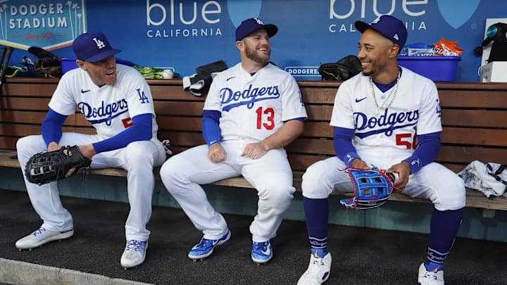 May 15, 2023; Los Angeles, California, USA; Los Angeles Dodgers first baseman Freddie Freeman (5), third baseman Max Muncy (13) and right fielder Mookie Betts (50)
 react during the game against the Minnesota Twins at Dodger Stadium. Mandatory Credit: Kirby Lee-Imagn Images