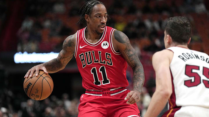 Dec 14, 2023; Miami, Florida, USA;  Chicago Bulls forward DeMar DeRozan (11) looks to set uptheoffense as Miami Heat forward Duncan Robinson (55) defends during the first half at Kaseya Center. Mandatory Credit: Jim Rassol-Imagn Images