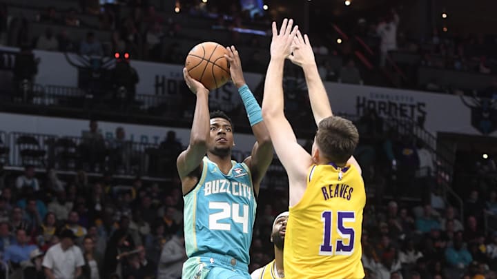 Feb 5, 2024; Charlotte, North Carolina, USA; Charlotte Hornets forward Brandon Miller (24) drives in past Los Angeles Lakers guard Austin Reaves (15) during the second half at the Spectrum Center. Mandatory Credit: Sam Sharpe-Imagn Images Feb 5, 2024; Charlotte, North Carolina, USA; Charlotte Hornets forward Brandon Miller (24) drives in past Los Angeles Lakers guard Austin Reaves (15) during the second half at the Spectrum Center. Mandatory Credit: Sam Sharpe-Imagn Images