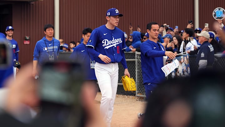 Feb 12, 2025; Glendale, AZ, USA; Los Angeles Dodgers pitcher Roki Sasaki (11) takes the field during a Spring Training workout at Camelback Ranch. Mandatory Credit: Joe Camporeale-Imagn Images